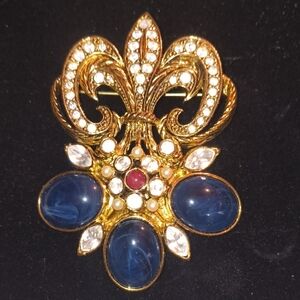 Elegant Gold and Blue Brooch